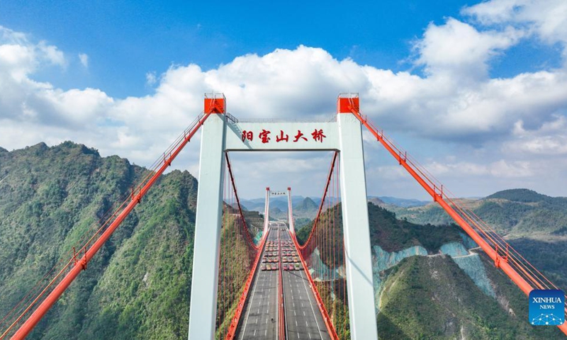 Aerial photo taken on Nov. 30, 2021 shows the Yangbaoshan bridge during a static load test in Guiding County, southwest China's Guizhou Province. The Yangbaoshan bridge carried out a static load test on Tuesday. Forty-eight large trucks with a total of 1,680 tonnes of goods were parked on the bridge to test the construction quality and mechanical properties of the bridge structure. (Photo: Xinhua)