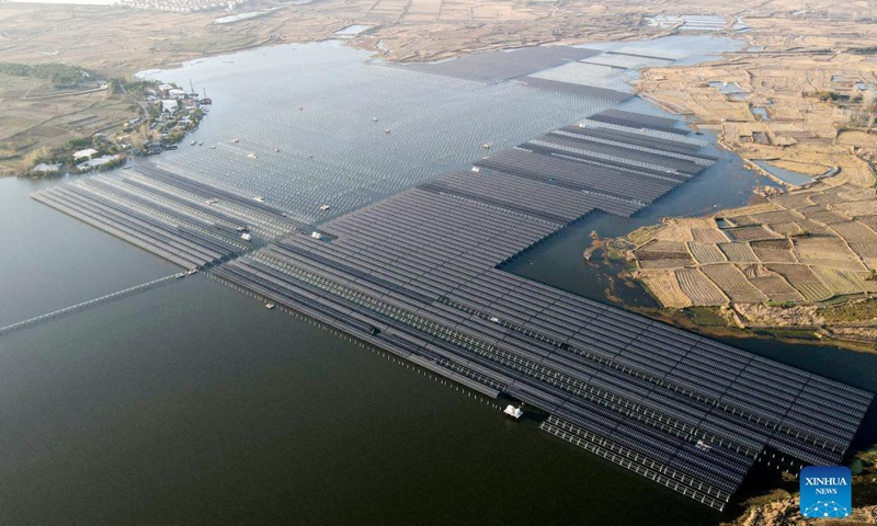 Aerial photo taken on Nov. 24, 2021 shows a photovoltaic (PV) power station at Jiangji reservoir in Feidong County of Hefei, east China's Anhui Province. A PV power station with a designed installed capacity of 50 megawatts at Jiangji reservoir in Hefei was successfully connected to the grid on Nov. 30.(Photo:Xinhua)
