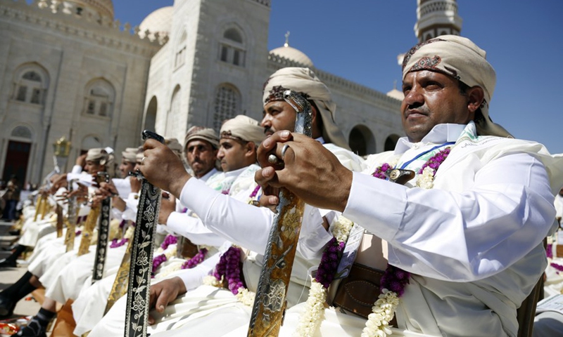 Grooms attend a mass wedding in a public square in Sanaa, Yemen on Dec. 2, 2021.(Photo: Xinhua)