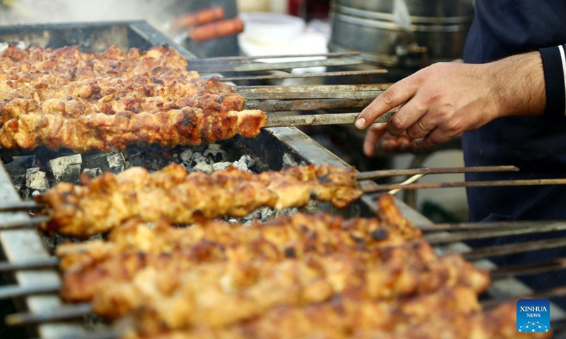 A man prepares food during a food festival in Islamabad, Pakistan, on Dec 3, 2021. The three-day food festival Islamabad Taste kicked off on Friday in Islamabad with more than 100 food stalls offering a variety of food to visitors.Photo:Xinhua