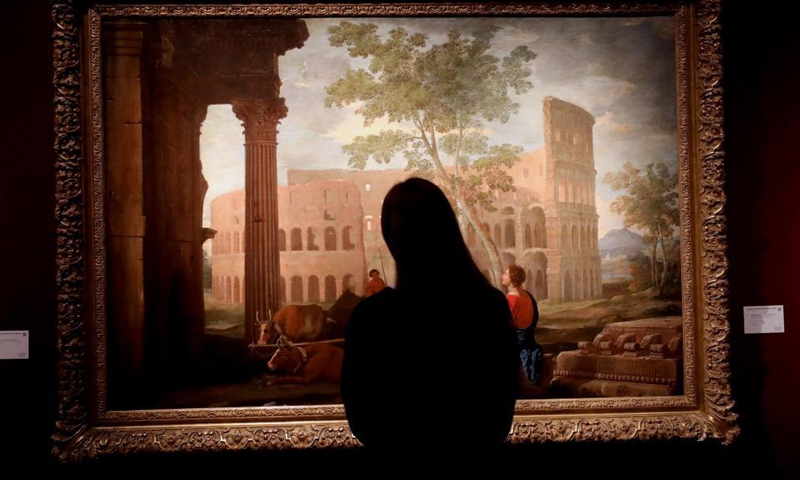 A woman views artwork The Colosseum for auction during a media preview of the Christie's London Classic Week auction in London, Britain, Dec. 3, 2021. Christie's London Classic Week presents art from antiquity to the 21st century, spanning five live auctions and four online-only sales.Photo:Xinhua