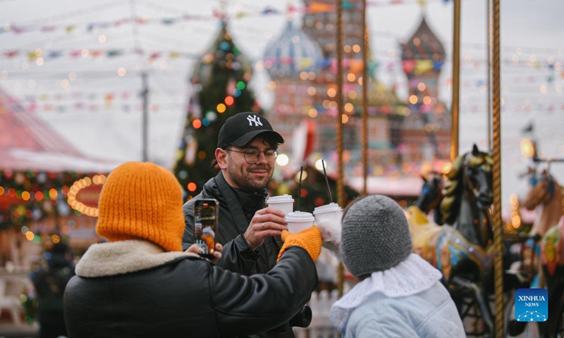 People cheer at a Christmas fair in Red Square in Moscow, Russia, on Dec. 3, 2021.Photo:Xinhua