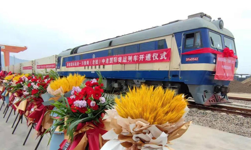 A train carrying 33 refrigerated containers departs from the Tengjun International Land Port in Kunming, capital of southwest China's Yunnan Province, for Laos, Dec. 4, 2021.Photo:Xinhua