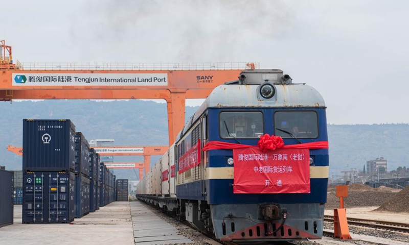 A train carrying 33 refrigerated containers departs from the Tengjun International Land Port in Kunming, capital of southwest China's Yunnan Province, for Laos, Dec. 4, 2021.Photo:Xinhua