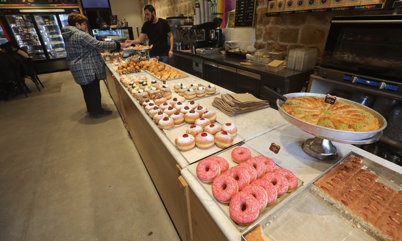 Various Sufganiyot, traditional Hanukkah jelly-filled donuts, are for sale during the Jewish holiday of Hanukkah at a patisserie in Jerusalem.(Photo: Xinhua)