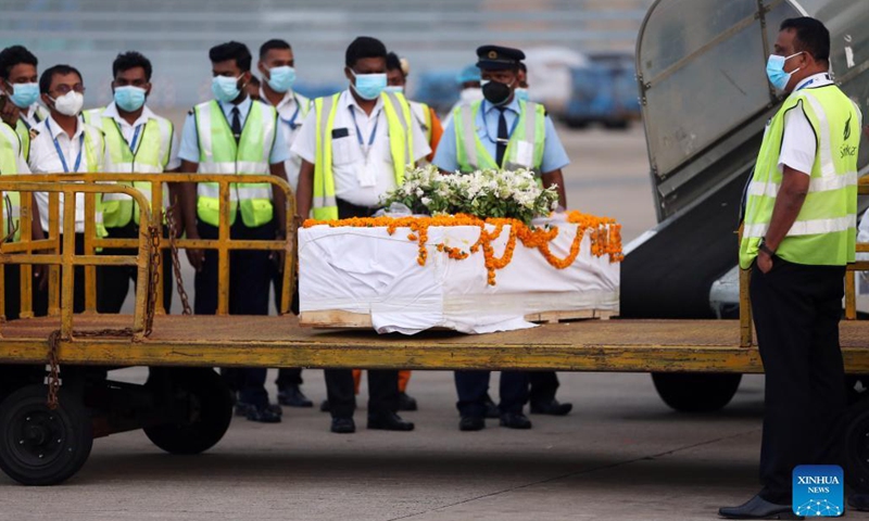The remains of Priyantha Kumara, a Sri Lankan manager killed by a mob in Pakistan last week, arrive at the Bandaranaike International Airport in Colombo, Sri Lanka, Dec. 6, 2021. Kumara, who was employed in a factory in Sialkot in Pakistan as an export manager, was brutally killed by a mob on Friday on allegations that he tore a poster pasted on the wall of the factory bearing religious sentiments. (Photo: Xinhua)