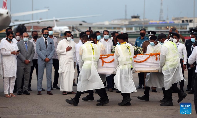 The remains of Priyantha Kumara, a Sri Lankan manager killed by a mob in Pakistan last week, arrive at the Bandaranaike International Airport in Colombo, Sri Lanka, Dec. 6, 2021. Kumara, who was employed in a factory in Sialkot in Pakistan as an export manager, was brutally killed by a mob on Friday on allegations that he tore a poster pasted on the wall of the factory bearing religious sentiments.(Photo: Xinhua)