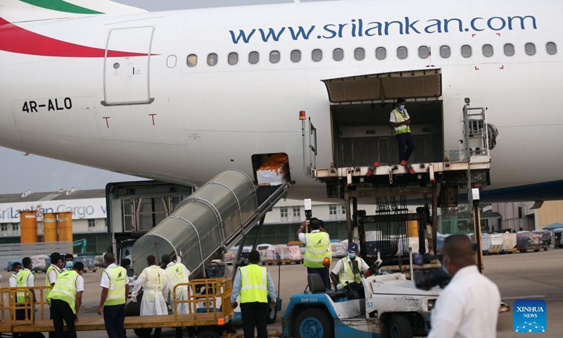 The remains of Priyantha Kumara, a Sri Lankan manager killed by a mob in Pakistan last week, arrive at the Bandaranaike International Airport in Colombo, Sri Lanka, Dec. 6, 2021. Kumara, who was employed in a factory in Sialkot in Pakistan as an export manager, was brutally killed by a mob on Friday on allegations that he tore a poster pasted on the wall of the factory bearing religious sentiments.(Photo: Xinhua)