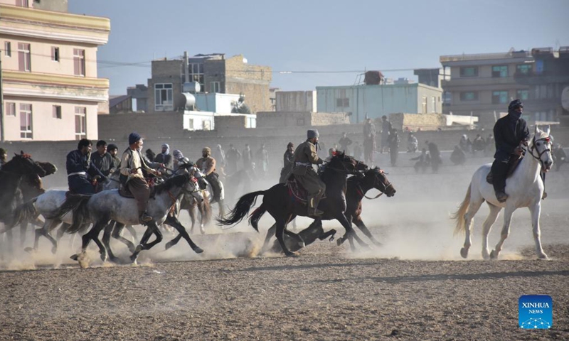 Afghan horse riders compete for a goat during a Buzkashi match in Mazar-i-Sharif, capital of Balkh province, Afghanistan, Dec. 10, 2021. Buzkashi or goat grabbing in English is a traditional tough game in Afghanistan, in which horse riding rivals compete fiercely to grab a goat carcass and deliver it to the goal, a circle on the ground.Photo:Xinhua