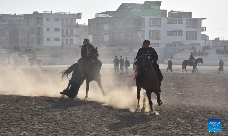 Afghan horse riders compete for a goat during a Buzkashi match in Mazar-i-Sharif, capital of Balkh province, Afghanistan, Dec. 10, 2021. Buzkashi or goat grabbing in English is a traditional tough game in Afghanistan, in which horse riding rivals compete fiercely to grab a goat carcass and deliver it to the goal, a circle on the ground.Photo:Xinhua
