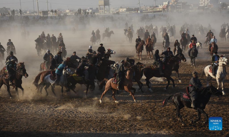 Afghan horse riders compete for a goat during a Buzkashi match in Mazar-i-Sharif, capital of Balkh province, Afghanistan, Dec. 10, 2021. Buzkashi or goat grabbing in English is a traditional tough game in Afghanistan, in which horse riding rivals compete fiercely to grab a goat carcass and deliver it to the goal, a circle on the ground.Photo:Xinhua