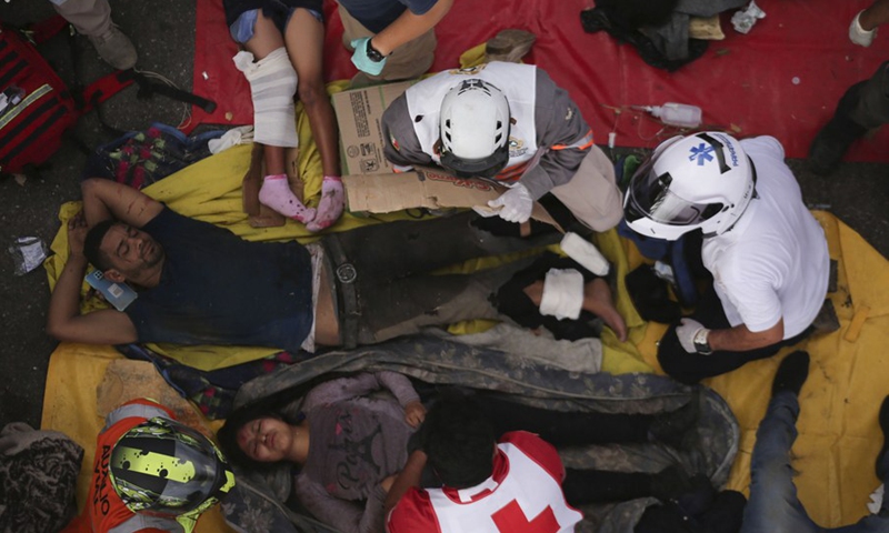 Rescuers work at the site of a traffic accident on the highway nearing Tuxtla Gutierrez, capital of southern Chiapas state, Mexico, Dec. 9, 2021.(Photo: Xinhua)