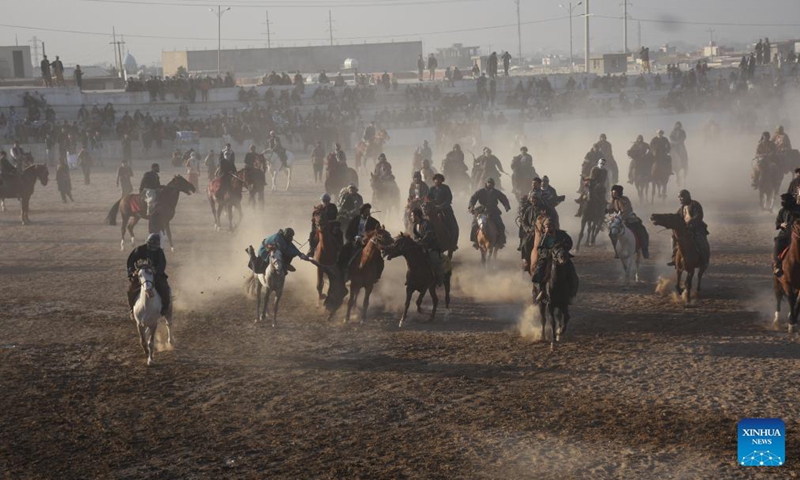 Afghan horse riders compete for a goat during a Buzkashi match in Mazar-i-Sharif, capital of Balkh province, Afghanistan, Dec. 10, 2021. Buzkashi or goat grabbing in English is a traditional tough game in Afghanistan, in which horse riding rivals compete fiercely to grab a goat carcass and deliver it to the goal, a circle on the ground.Photo:Xinhua