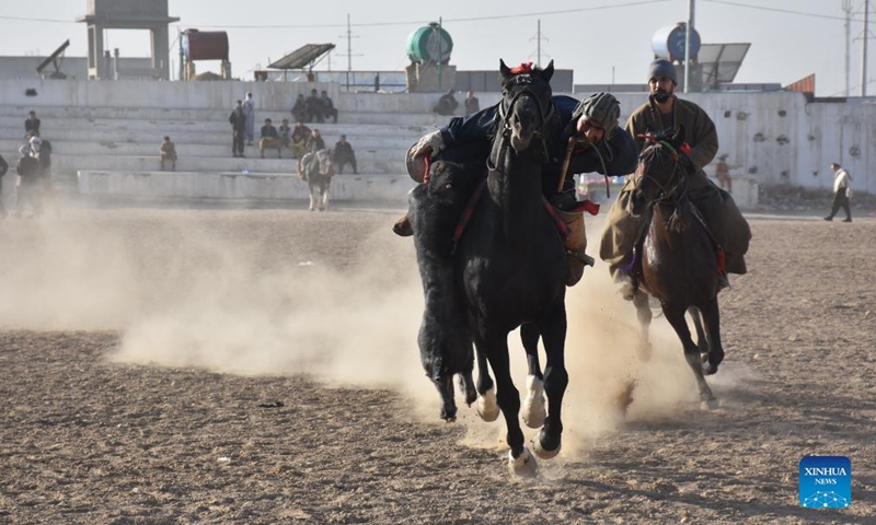 Afghan horse riders compete for a goat during a Buzkashi match in Mazar-i-Sharif, capital of Balkh province, Afghanistan, Dec. 10, 2021. Buzkashi or goat grabbing in English is a traditional tough game in Afghanistan, in which horse riding rivals compete fiercely to grab a goat carcass and deliver it to the goal, a circle on the ground.Photo:Xinhua