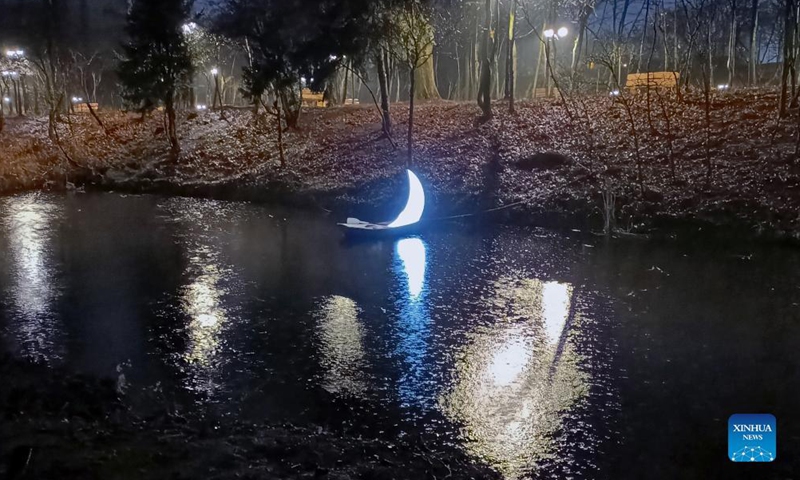 A light installation is exhibited in a park during the Lights On Romania festival in Bucharest, Romania, on Dec. 10, 2021.Photo:Xinhua