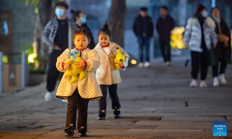 Kids play in an old street in southwest China's Chongqing Municipality, Dec. 10, 2021.Photo:Xinhua