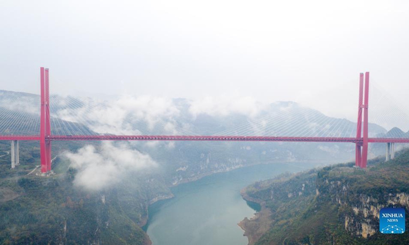 Aerial photo taken on Nov. 26, 2021 shows the Yachihe Bridge of Guiyang-Qianxi Expressway in southwest China's Guizhou Province. Guizhou, with 92.5 percent of its area covered by mountains and hills, has built over 20,000 bridges since late 1970s. (Photo: Xinhua)