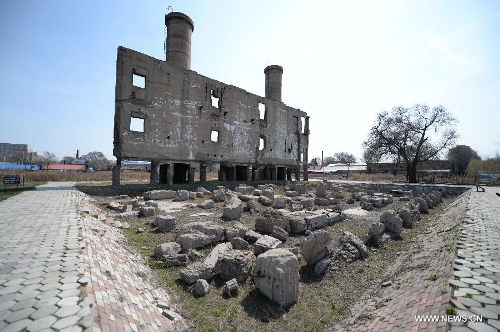 Photo taken on April 18, 2014 shows the ruins of a Unit 731 boiler building in Harbin, capital of northeast China's Heilongjiang Province. Unit 731 was a Harbin-based biological and chemical warfare research unit of the Japanese army during WWII. The Unit 731 facility ruins in Harbin are evidences of the wartime atrocities committed by Japanese invaders in China. Unit 731 members conducted a series of human experiments which subjected victims to vivisections, germ war attacks, weapon tests and other forms of torture. April 18 is the International Day for Monuments and Sites. Its theme for 2014 is heritage for commemoration. (Xinhua/Wang Kai)  