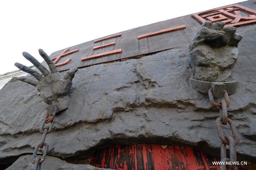 Photo taken on April 18, 2014 shows a sculpture at the Unit 731 ruins and sites in Harbin, capital of northeast China's Heilongjiang Province. Unit 731 was a Harbin-based biological and chemical warfare research unit of the Japanese army during WWII. The Unit 731 facility ruins in Harbin are evidences of the wartime atrocities committed by Japanese invaders in China. Unit 731 members conducted a series of human experiments which subjected victims to vivisections, germ war attacks, weapon tests and other forms of torture. April 18 is the International Day for Monuments and Sites. Its theme for 2014 is heritage for commemoration. (Xinhua/Wang Kai)  