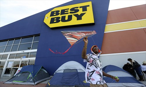 front of a best buy store where his family is camped out in cock