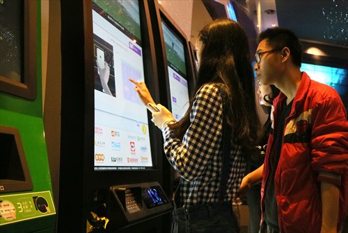 Consumers get movie tickets they bought via online platforms such as meituan.com in a cinema in Fuzhou, East China's Fujian Province on April 25. Photo: CFP
