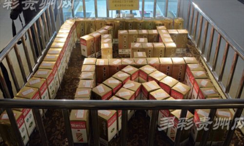 Boxes of confiscated liquor are arranged to create the Chinese character for 
