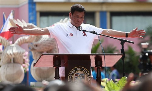 Philippine president-elect Rodrigo Duterte speaks before city hall employees in Davao City, in the southern island of Mindanao on Monday, three days before taking his oath as president. Duterte hit out at 