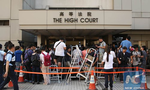 Media staff wait outside the High Court in Hong Kong, south China, Nov. 15, 2016. File photo: Xinhua