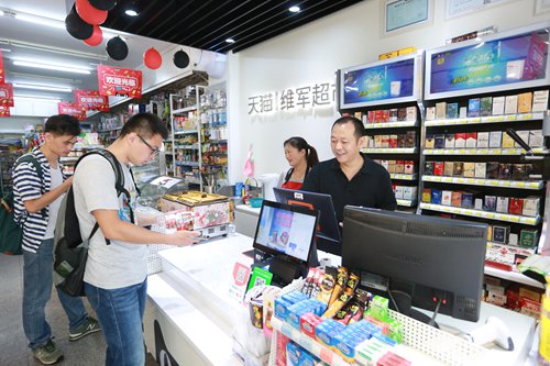 Customers purchase goods at a convenience store, dubbed as 