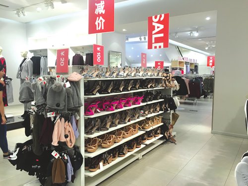 Shoes are arranged on shelves for sale at an H&M shop in the Joy City shopping mall in Beijing's Chaoyang district at Thursday noon. Photo: Ma Jingjing/GT