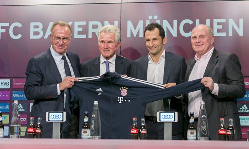 (From left) Karl-Heinz Rummenigge, Jupp Heynckes, Hasan Salihamidzic and Uli Hoeness pose for pictures during a Bayern Munich press conference at the Alianz Arena on Monday in Munich, Germany. Photo: VCG