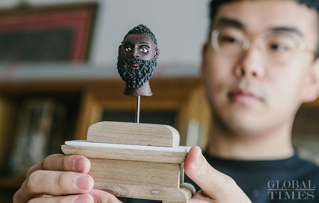 lang jiaziyu shows his dough sculpture which imitates nba star