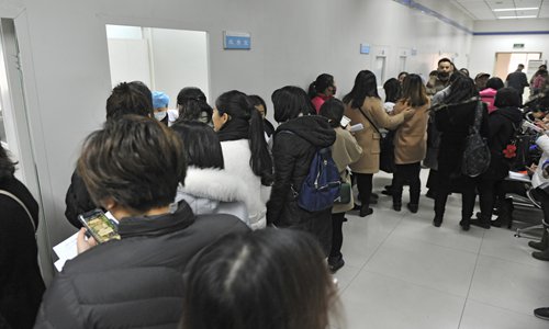 Women wait in line to receive HPV vaccines at a hospital in Xi'an, capital of Northwest China's Shaanxi Province in December 2017. Photo: VCG