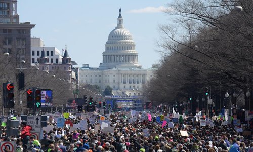 People take part in the March for Our Lives rally in Washington D.C., the United States, on March 24, 2018. Hundreds of thousands of people gathered at Pennsylvania Avenue in Washington D.C. on Saturday for the March for Our Lives gun control rally, demanding the end of gun violence and mass school shootings. Photo: Xinhua/Yang Chenglin