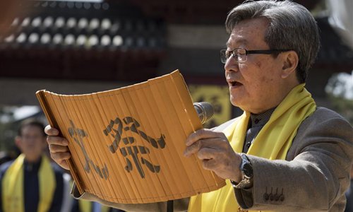 A man reads ritual oration on the ceremony in memory of Zhang Qian, in Chenggu County, northwest China's Shaanxi Province, April 3, 2018. Zhang Qian, a royal emissary in China's Han Dynasty (202 B.C.-220 A.D.), traveled westward on a mission of peace and opened an overland route linking the East and the West, a daring undertaking which came to be known as Zhang Qian's journey to the Western regions. (Xinhua/Tao Ming)