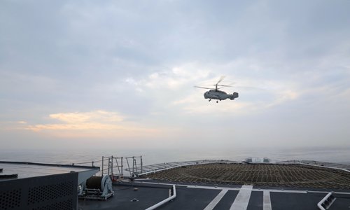 A ship-borne Ka-28 helicopter attached to a destroyer flotilla with the navy under the PLA Eastern Theater Command lifts off from the flight deck of the guided-missile destroyer Taizhou (Hull 138) during a maritime training exercise in late March, 2018. (eng.chinamil.com.cn/Photo by Wen Zidong)