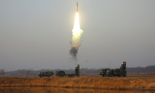 An HQ-9 air defense missile system attached to a surface-to-air missile brigade of the air force under the PLA Central Theater Command fires surface-to-air missiles at simulated aerial target during a live-fire operation in mid-April, 2018. (eng.chinamil.com.cn/Photo by Zhu Jianghai)
