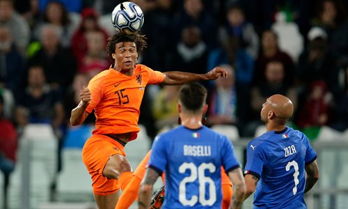 Nathan Ake of the Netherlands heads the ball during their international friendly match against Italy at the Allianz Stadium on Monday in Turin, Italy. Photo: VCG