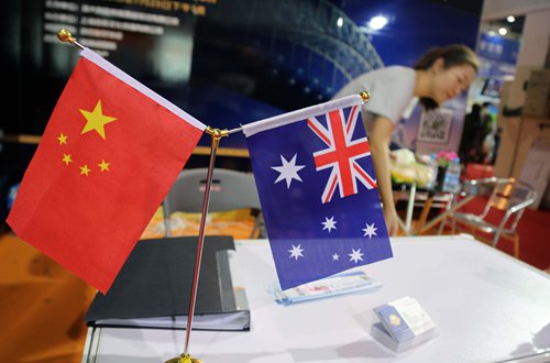 Chinese and Australian flags displayed at an investment fair in Shanghai Photo: IC