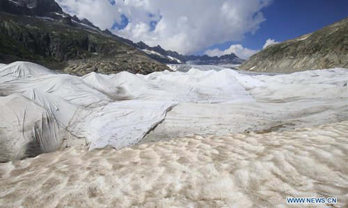 Photo taken on Aug. 5, 2018 shows the Rhone Glacier covered with white blankets near the Furka Pass in Switzerland. The Rhone Glacier is protected by special white blankets to prevent it from further melting as a result of global warming. (Xinhua/Xu Jinquan)

