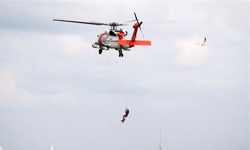 US Coast Guard perform during the 60th Annual Chicago Air and Water Show over North Avenue Beach in Chicago, the United States, Aug. 18, 2018. The two-day Chicago Air and Water Show began on Saturday. (Xinhua/Wang Ping)