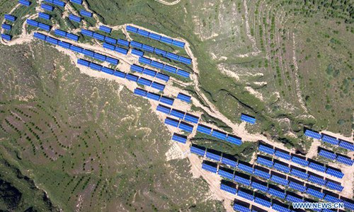 Aerial photo taken on Sept. 4, 2018 shows a photovoltaic power plant in Loufan County, Taiyuan City, north China's Shanxi Province. In recent years, the county has vigorously developed and utilized solar energy by building photovoltaic power plants on barren mountains. (Xinhua/Cao Yang)