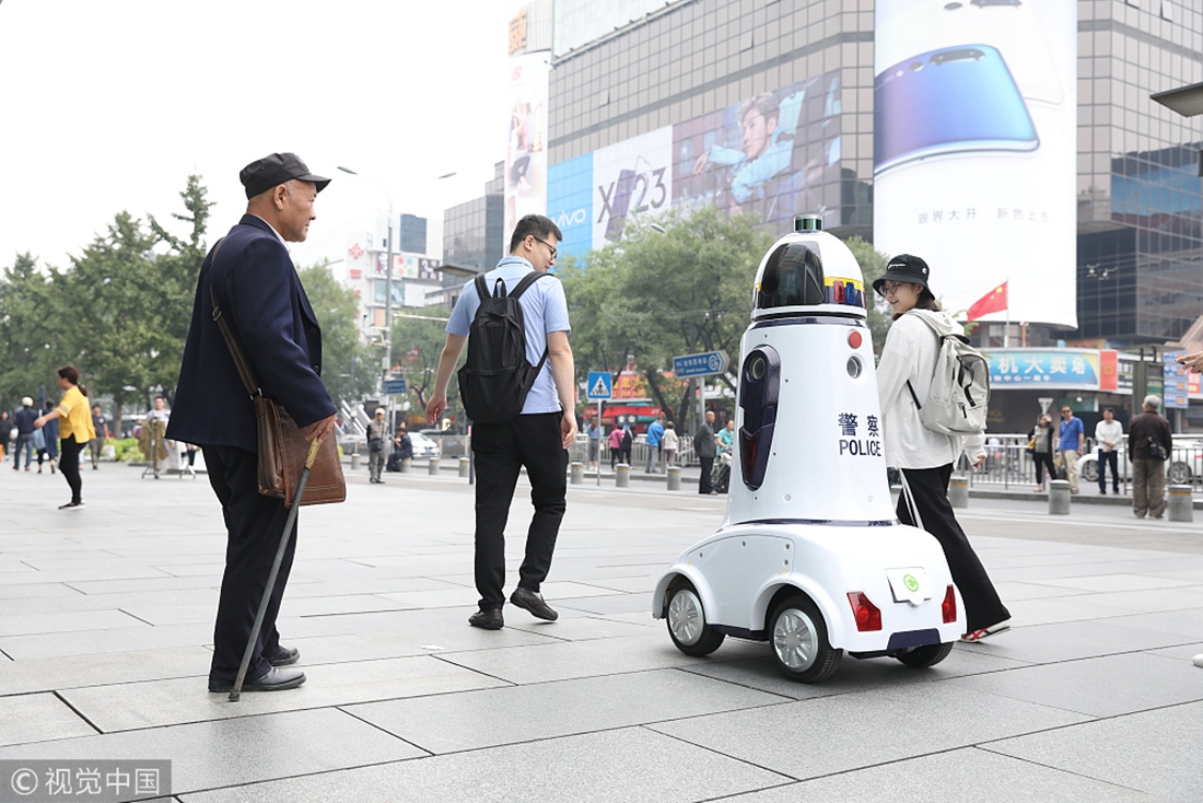 Robocop on duty Robot patrols a street in Beijing Global Times