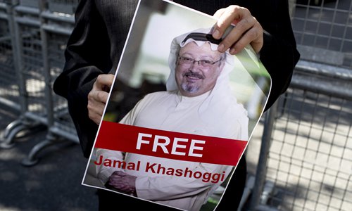 A protester holds a picture of Saudi Journalist Jamal Khashoggi during a demonstration organized by Turkish-Arabic Media Association in front of the Saudi Arabian consulate in Istanbul, Turkey on October 5. Photo: IC