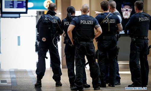 Police stand at Cologne Central railway station on October 15, 2018 in Cologne, Germany. The German police ended a hostage-taking in Cologne Central Station on Monday and freed a woman from the violence after hours of tension. (Xinhua/Ulrich Hufnagel)