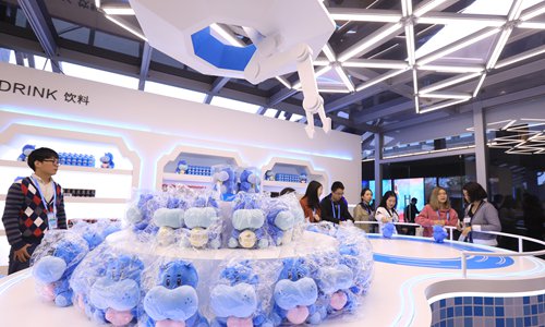 Visitors look at the intelligent expression pavilion of Hema Fresh Store, an online-to-offline retailer under the e-commerce platform Alibaba Group, at the Light of the Internet Expo during the fifth World Internet Conference in Wuzhen, East China's Zhejiang Province, on Tuesday. The conference will be held from Wednesday to Friday, featuring topics such as artificial intelligence, 5G, big data and internet security. More than 1,500 guests from 80 countries and regions will participate in the event. Photo: IC