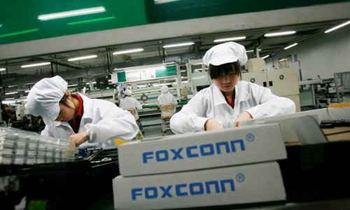 Employees work at a Foxconn factory in the township of Longhua, South China's Guangdong Province File photo: VCG