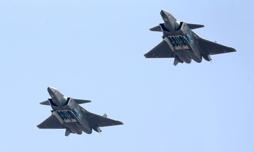 Two J-20s howling through the sky with their missile bays open, each showcasing six missiles as the stealth fighter jets celebrated the 69th birthday of the Chinese People's Liberation Army Air Force on the last day of the Airshow China 2018 in Zhuhai, Guangdong Province on Sunday.  Photo: Cui Meng/GT