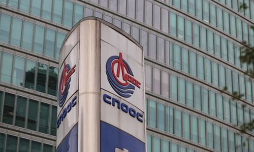 CNOOC's logo is displayed in front of the company's Beijing headquarters. Photo: VCG