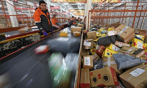 Staff members work at the distribution center of an express company in Yinchuan, northwest China's Ningxia Hui Autonomous Region, Nov. 12, 2018. More than 1.35 billion parcels were generated during the shopping spree on major e-commerce platforms on Nov. 11, 2018, data from China's State Post Bureau showed. China's e-commerce giant Alibaba launched the annual online shopping promotion on Nov. 11, 2009, a day celebrated by many Chinese young people as Singles' Day. (Xinhua/Wang Peng)